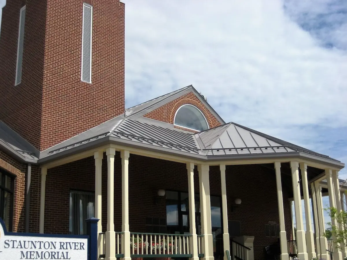 Skilled roofing craftsmen working on a residential roof in Howard